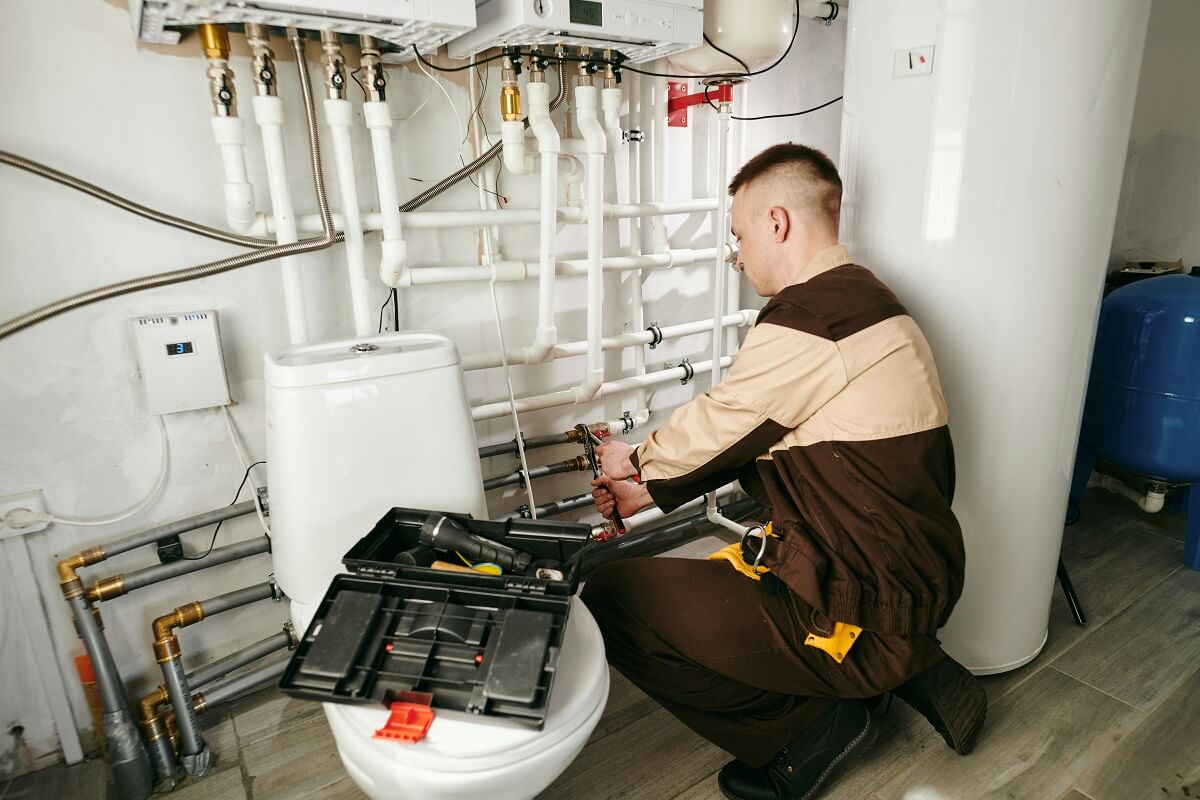 Plumbing Technician working on pipes | Residential Plumbing Services | Expert Home Plumbing Care